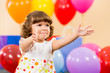 Foto : smiling child girl with balloons on birthday party smiling child girl with balloons on birthday party
