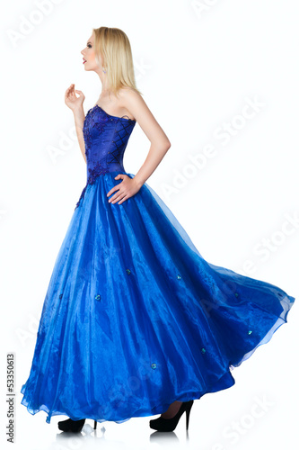 Photo: Young woman in luxurious blue dress Young woman in luxurious blue dress