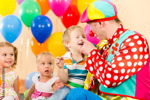 Photo: happy kid boy and clown on birthday party happy kid boy and clown on birthday party