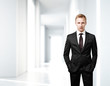 businessman standing in bright office