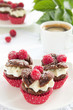 Photo: Chocolate muffins with raspberries and cream. Chocolate muffins with raspberries and cream.
