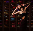 Sensual Woman in Wardrobe with Plenty of Footwear
