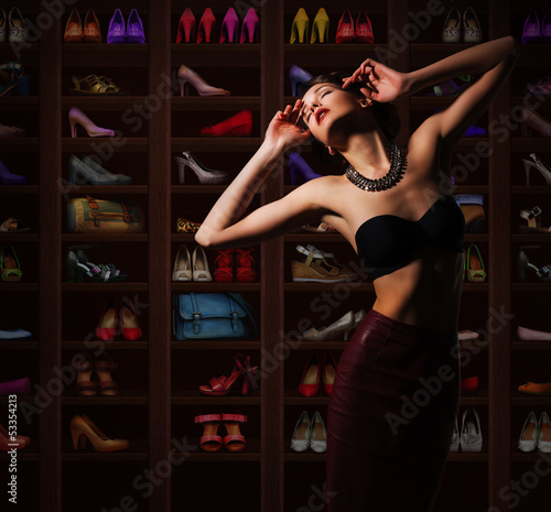 Photo: Sensual Woman in Wardrobe with Plenty of Footwear Sensual Woman in Wardrobe with Plenty of Footwear