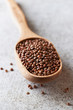 Photo: Brown lentils in a wooden spoon Brown lentils in a wooden spoon
