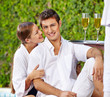 Photo: Paar im Urlaub am Pool mit Sekt Paar im Urlaub am Pool mit Sekt