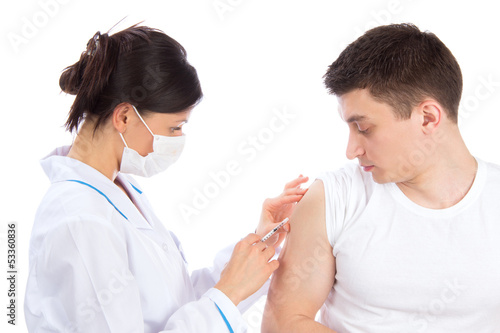 Photo: Doctor give flu vaccination or insulin injection Doctor give flu vaccination or insulin injection