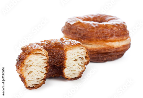 Photo: Croissant and doughnut mixture isolated on white Croissant and doughnut mixture isolated on white