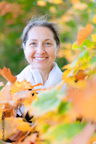 Photo: happy mature woman in autumn happy mature woman in autumn