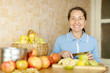 Photo: Woman cuts apples for apple jam Woman cuts apples for apple jam