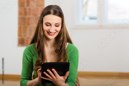 Photo: Young woman doing online dating Young woman doing online dating