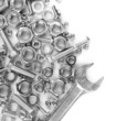 Bolts, screws, nuts, wrench isolated on white