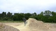 BMX biker jumping dirt jumps