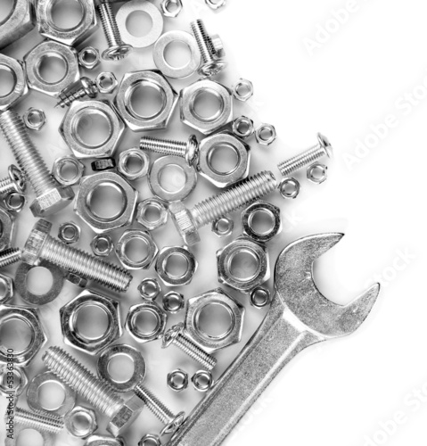 Photo: Bolts, screws, nuts, wrench isolated on white Bolts, screws, nuts, wrench isolated on white