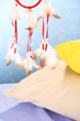 Beautiful dream catcher and pillows on blue background