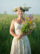 Photo: mature woman in camomile wreath mature woman in camomile wreath