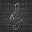 Glass treble clef on metal texture background.