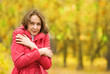 the beautiful girl freezing in autumn park