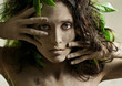 young woman, smeared with clay