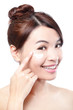 Photo: Beauty young woman applying cosmetic cream Beauty young woman applying cosmetic cream