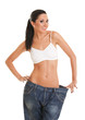 Funny woman shows her weight loss by wearing an old jeans, isola