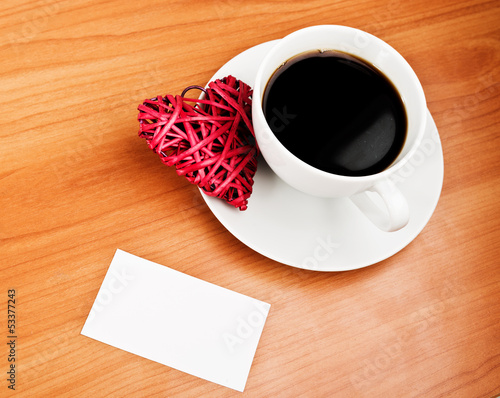 Photo: Red straw heart and cup of coffee Red straw heart and cup of coffee