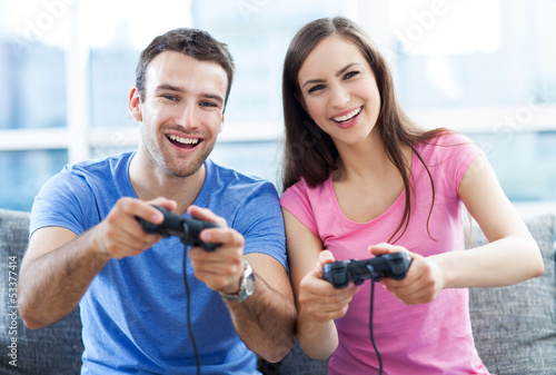 Photo: Couple playing video games Couple playing video games