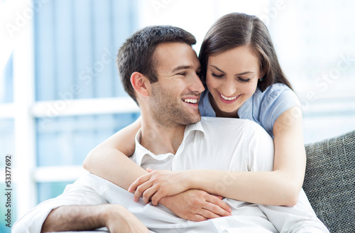 Photo: Couple hugging at home Couple hugging at home