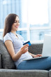 Woman with laptop and credit card