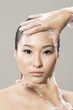 Chinese woman receiving Beauty Treatment.
