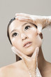 Chinese woman receiving Beauty Treatment.