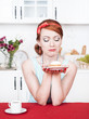 Photo: Sad beautiful woman looking on cake Sad beautiful woman looking on cake