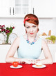 Photo: Woman choosing between healthy food and cake Woman choosing between healthy food and cake