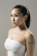 Chinese woman with Bandage on her Arm