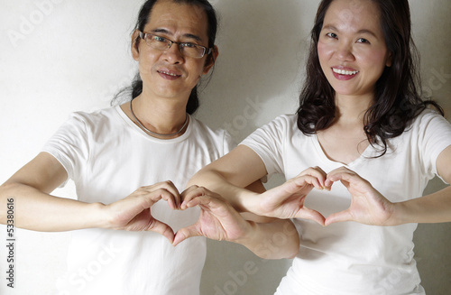Photo: romantic couple making heart shape romantic couple making heart shape