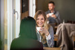 Photo: Young Woman With Friend Having Coffee At Cafe Young Woman With Friend Having Coffee At Cafe