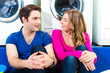 Photo: couple in a coin laundry washing couple in a coin laundry washing