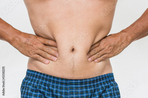 Photo: Man showing his fat on the stomach Man showing his fat on the stomach