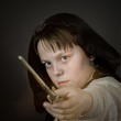 Portrait of teenage boy dressed in wizard costume
