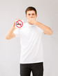 young man holding no smoking sign