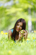 Photo: Woman with apple outdoors Woman with apple outdoors