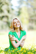 Photo: Woman sitting on flower field Woman sitting on flower field