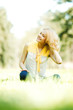 Photo: Woman sitting on grass Woman sitting on grass