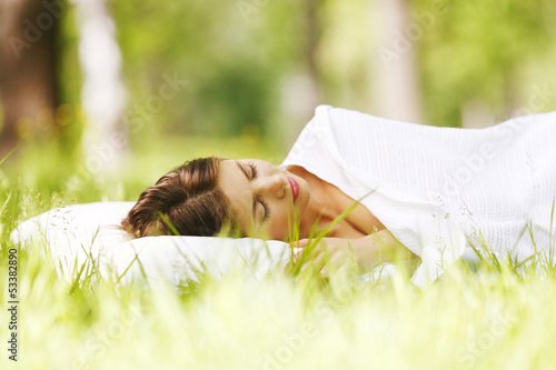 Photo: Woman sleeping on grass Woman sleeping on grass