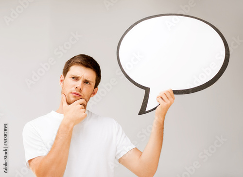 Photo: young man with blank text bubble young man with blank text bubble