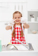 Happy little girl washing the dishes