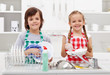 Foto: Happy kids helping in the kitchen Happy kids helping in the kitchen