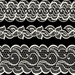 Lace fabric seamless borders with abstract flowers.