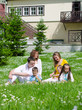 Photo: Company of friends with children having fun on a picnic Company of friends with children having fun on a picnic