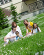 Photo: Company of friends with children having fun on a picnic Company of friends with children having fun on a picnic