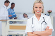 Blonde nurse crossing her arms